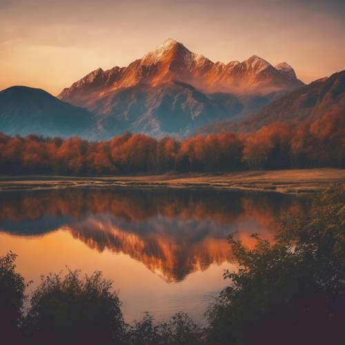 A scenic mountain range bathed in the warm hues of a morning sunrise.