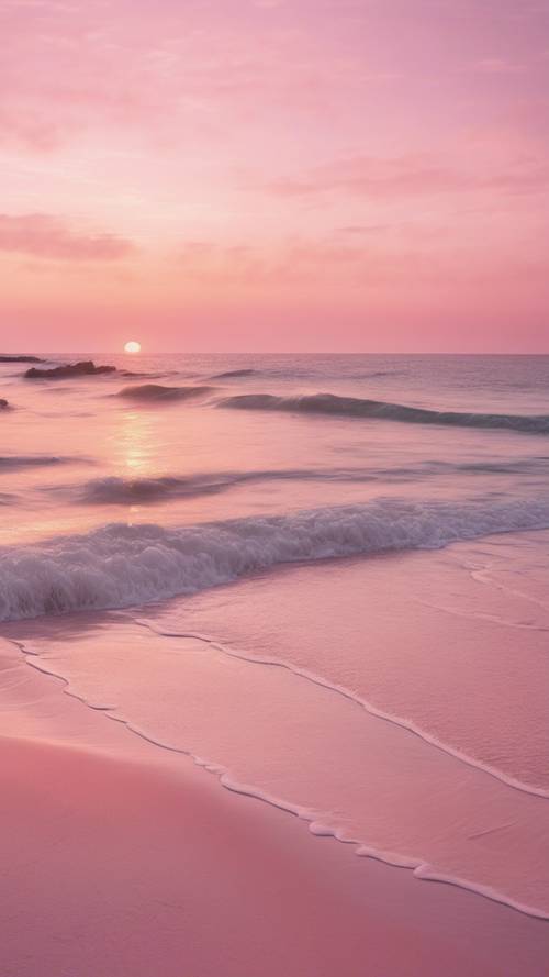 Ein pastellrosa Strand bei Sonnenuntergang.