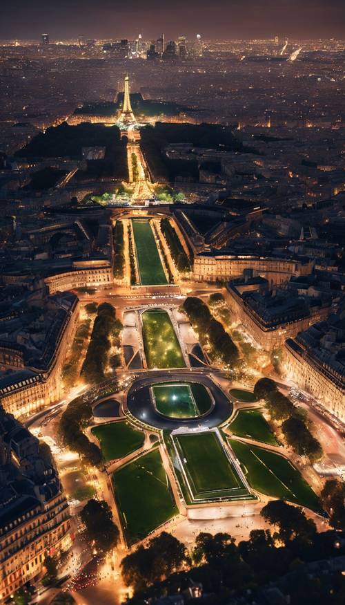 منظر ليلي بانورامي لباريس من أعلى برج إيفل، وأضواء المدينة ممتدة مثل حقل النجوم.