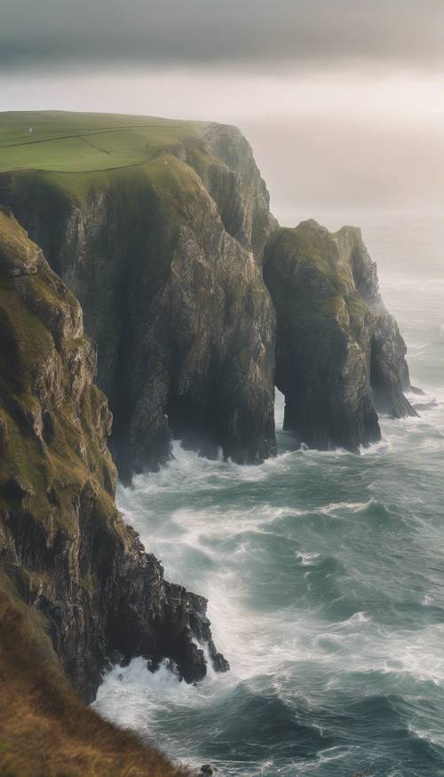 A foggy coastline scene in a Celtic land, where towering cliffs meet the thunderous waves of the sea.