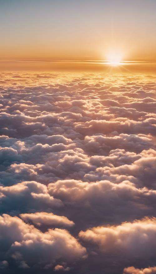 Pemandangan dari jendela pesawat menampilkan indahnya matahari terbit di atas awan. Wallpaper [543b3c8e49db457ebda2]