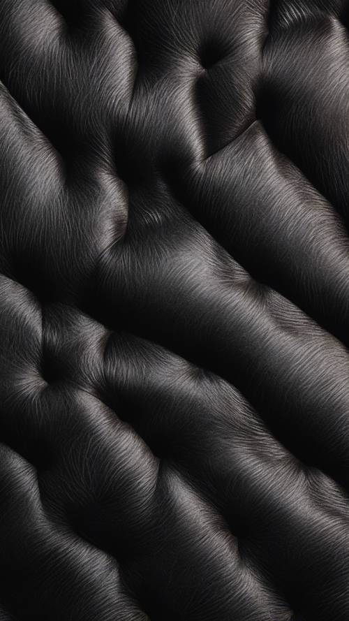 Stampa in pelle di vacchetta nera su una lussuosa texture in velluto.