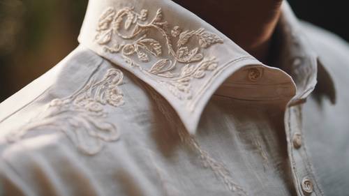 A close-up shot of a luxury linen shirt's intricate embroidery details.