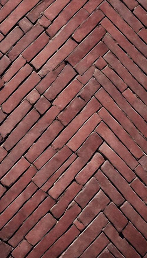 Pattern of burgundy bricks laid in a herringbone style