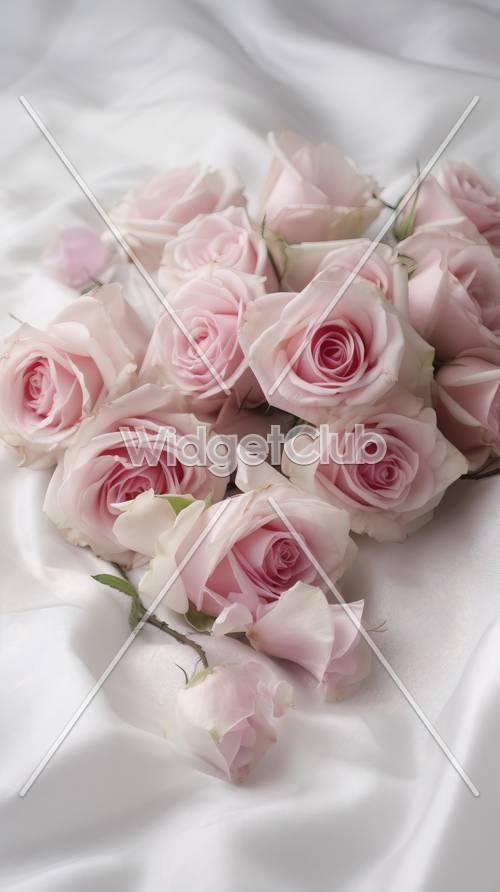 الورود الوردية على القماش الأبيض