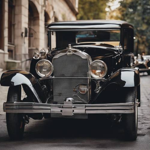 A classic, polished black vintage car of the 1920s, used by mafia mobsters.