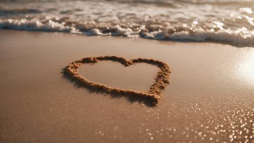 A heart drawn in the wet sand of a beach, the color of light brown sugar, with waves crashing in the background.