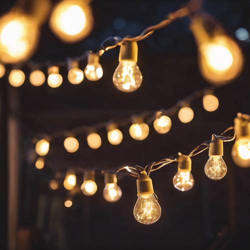 A festoon of fairy lights illuminating a backyard full of happy faces, accompanied by the harmonious strums of an acoustic guitar.