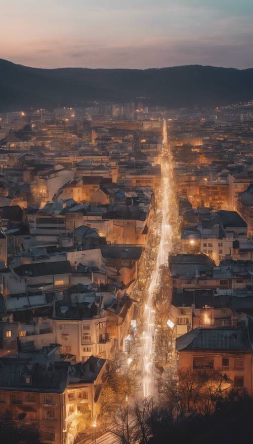 Minutos antes de que comience el Año Nuevo, una vista desde la cima de una colina de una ciudad llena de luces y lista para la gran cuenta regresiva.