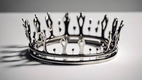 A minimalist and modern crown made of sleek, polished metal bands, drawing the eye to its simplicity and symbolizing contemporary power.