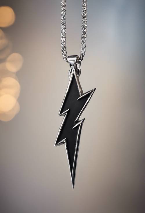 A close-up shot of a black lightning bolt pendant on a silver chain.
