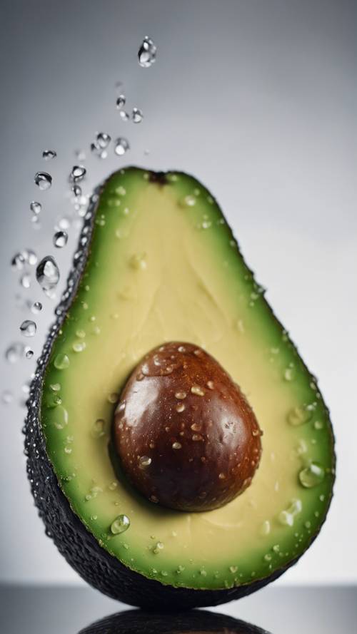A detailed macro shot showing the texture of a ripe avocado, with dew drops on its surface.