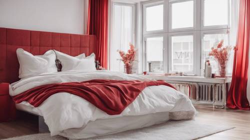 A contemporary bedroom decorated in minimalist red and white theme.