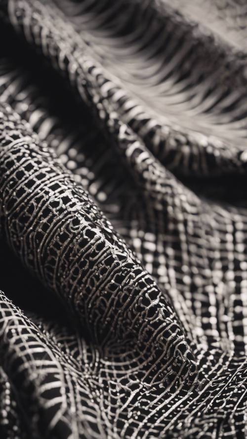 An intricate black pattern on a luxurious silk fabric".