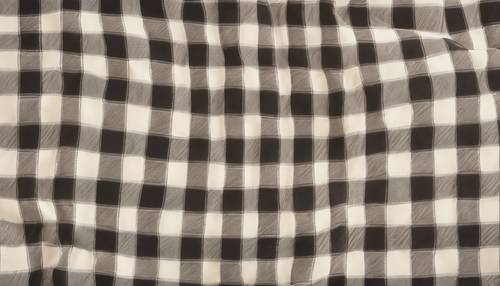 A detailed cream plaid pattern on a glossy satin