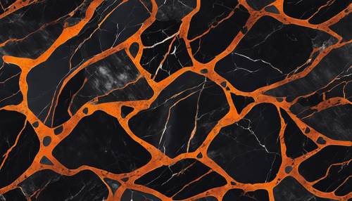 Der Blick auf polierten schwarzen Marmor mit kontrastierenden orangefarbenen Adern.