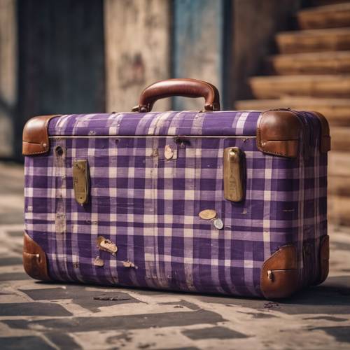 Vintage suitcase covered in worn-out purple plaid fabric, adorned with travel stickers Tapeta [90ca800ae52640e4ac3e]