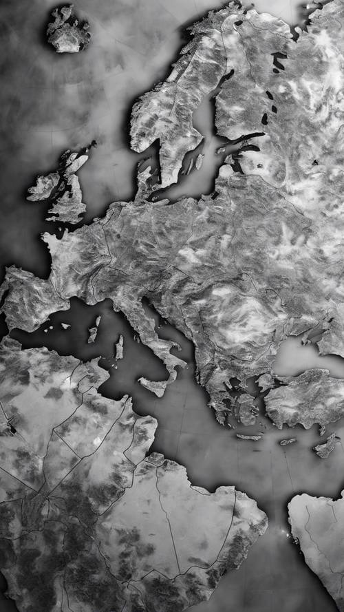 Widok satelitarny mapy świata w skali szarości wydrukowanej na błyszczącym papierze.