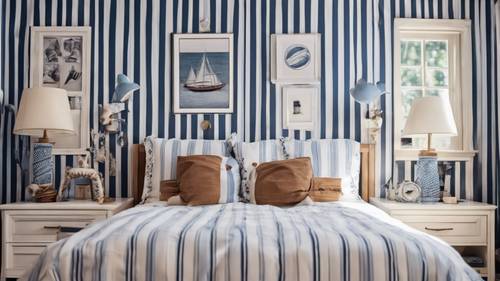 A classic preppy bedroom, with blue and white striped wallpaper and nautical themed decor.