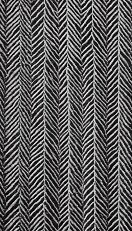 Tekstil vintage yang menampilkan pola herringbone monokrom.