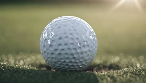 Close-up of a golf ball just before it hits the club head.