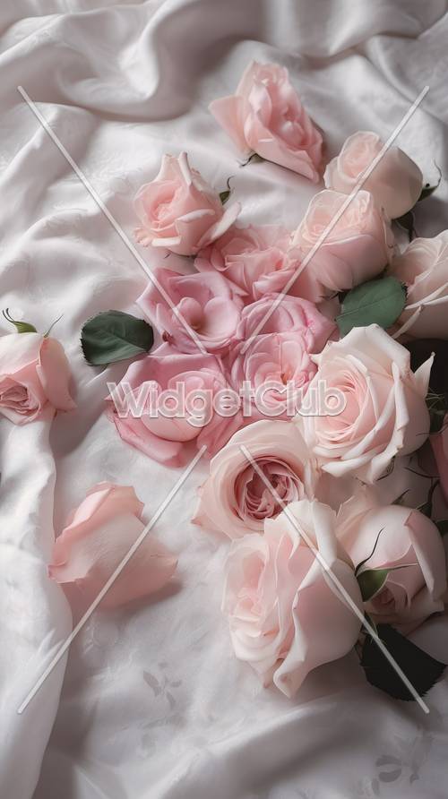 Rosas cor de rosa em fundo de tecido branco