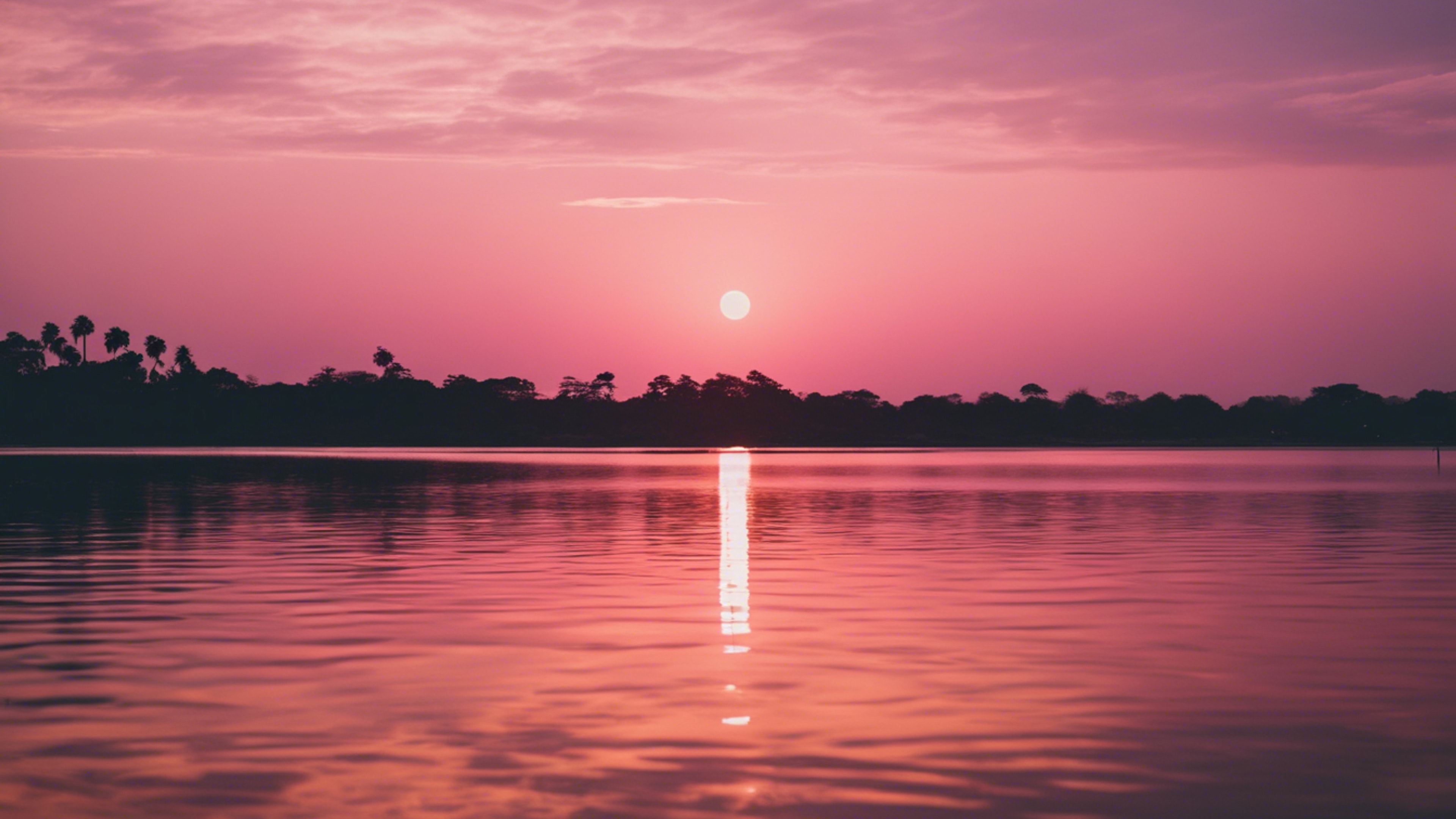 A picturesque pink and gold sunset reflecting on tranquil lagoon waters.壁紙[938883e46b5847a4931b]