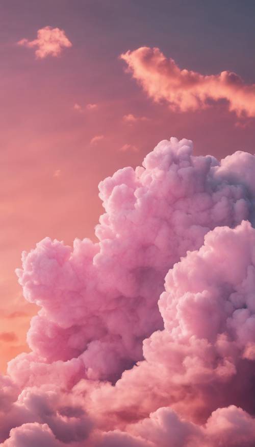 Langit dipenuhi awan permen kapas merah muda halus saat matahari terbenam.