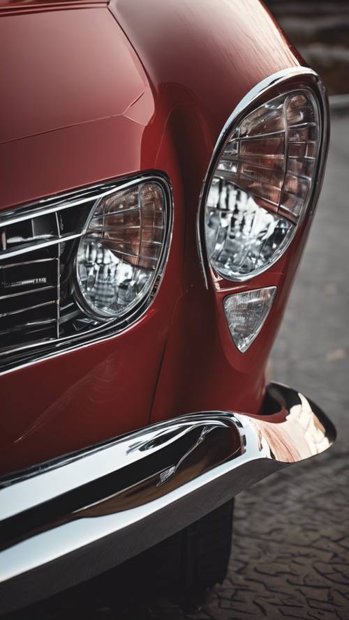 Close-up da frente de um carro de luxo vermelho com faróis elegantes.