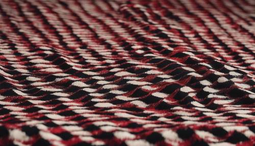 Magnifique motif pied-de-poule rouge et noir sur un luxueux tissu en laine