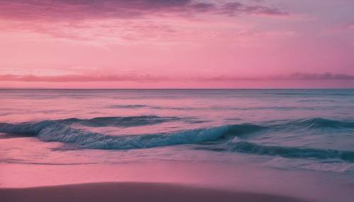 A seascape featuring a calm ocean under a pink to blue ombre evening sky.