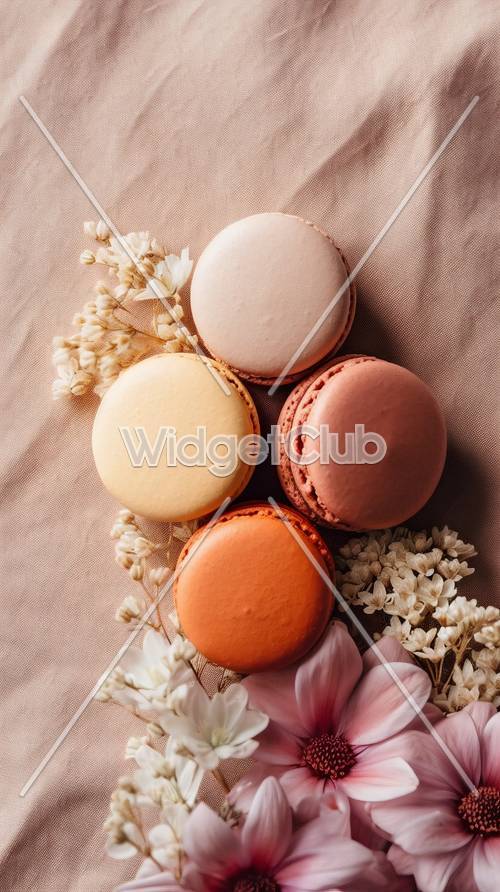 Macarons coloridos sobre una tela texturizada