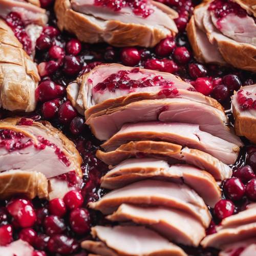 Slices of cranberry-studded turkey, a twist on the classic Thanksgiving dish with a pinkish tinge.