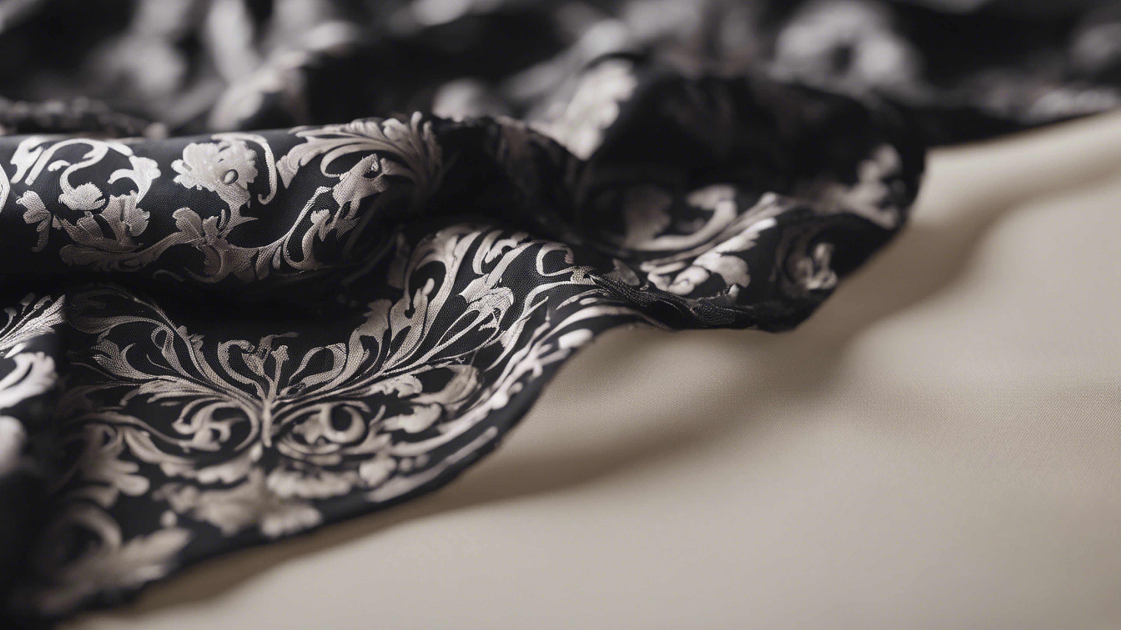 A piece of black damask fabric flowing in the wind on a neutral background. วอลล์เปเปอร์[14b62583c63644549a6a]