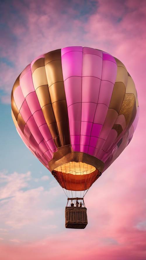 Un globo aerostático en vibrantes tonos rosa y dorado, flotando contra un cielo azul claro.