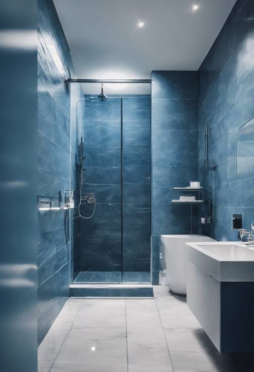 Kamar mandi biru minimalis dengan shower kaca dan perlengkapan berwarna putih.