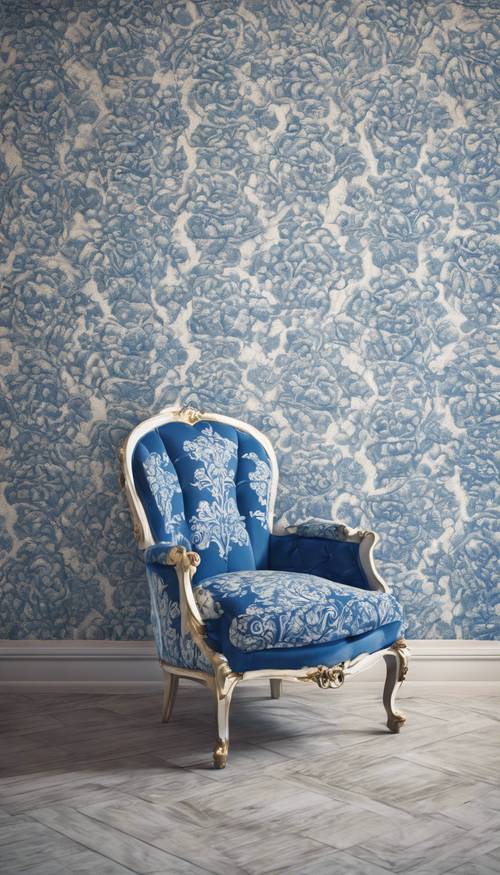 An antique armchair upholstered with blue and white damask fabric.