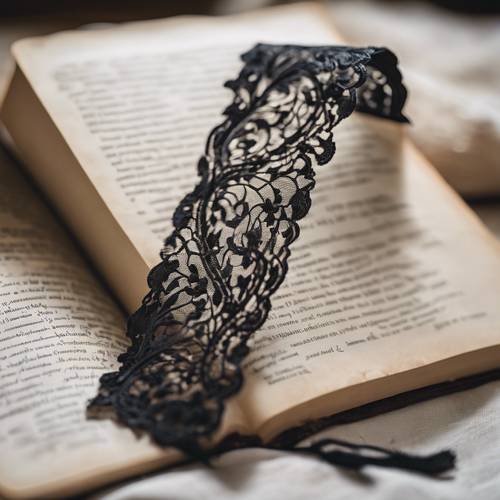Delicate black lace bookmark left in an ancient tome Tapet [be5f512cafe44295a77f]